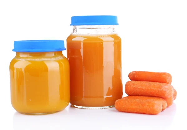 Baby food with carrot in glass jars, isolated on white — Stock Photo, Image