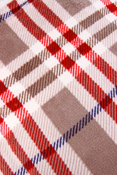 Ornament on plaid close-up background — Stock Photo, Image