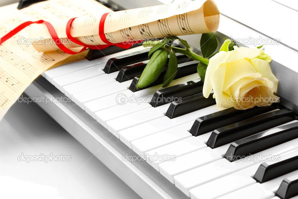 background of synthesizer keyboard with flower