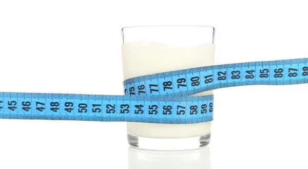 Glass of milk with measuring tape isolated on white — Stock Photo, Image