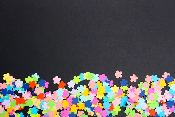 Confetti on black background — Stock Photo, Image