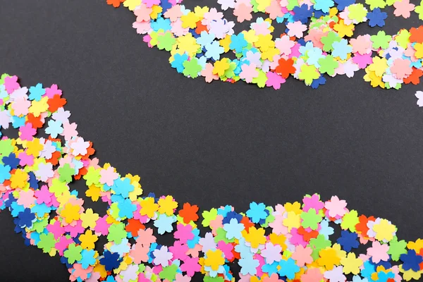 Confetti on black background — Stock Photo, Image