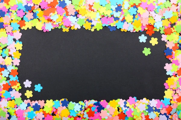 Confetti on black background — Stock Photo, Image