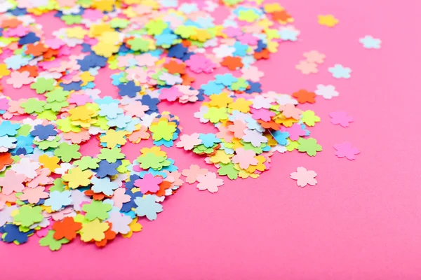 Confetti on pink background — Stock Photo, Image