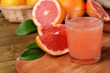 Ripe grapefruit with juice clipart