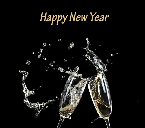 Glasses of champagne with splash, on black background — Stock Photo, Image