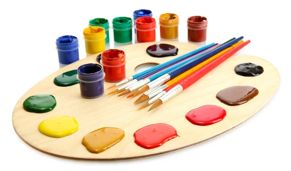 Holzkunstpalette mit Farbe und Pinsel — Stockfoto