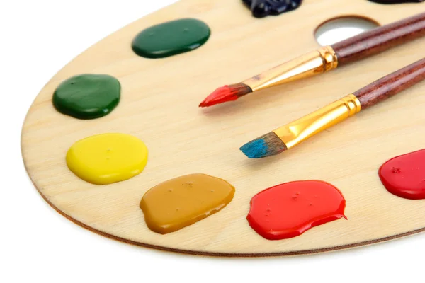 Wooden art palette with  paint and brushe — Stock Photo, Image