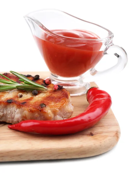 Grilled steak with spices, herbs and vegetables  on wooden board, isolated on white — Stock Photo, Image