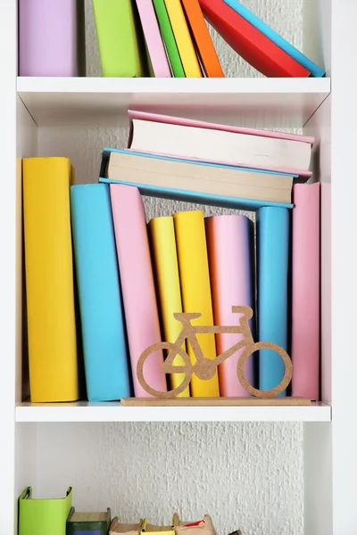 Books on white shelves close-up — Stock Photo, Image