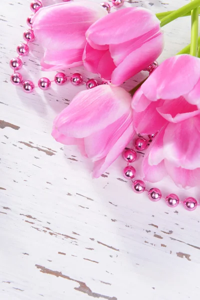 Beautiful tulips in bucket on table close-up — Stock Photo, Image