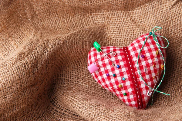 Fabric heart with color pins — Stock Photo, Image