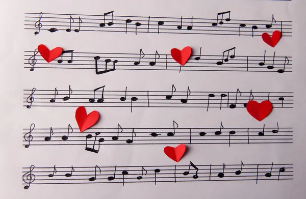 Paper hearts on music book — Stock Photo, Image