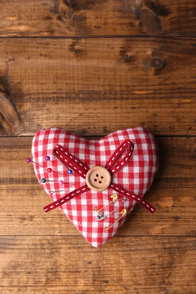 Fabric heart with color pins Stock Picture