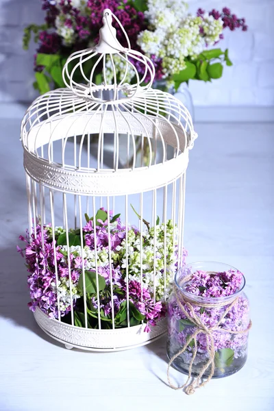 Lilac flowers in decorative cell — Stock Photo, Image