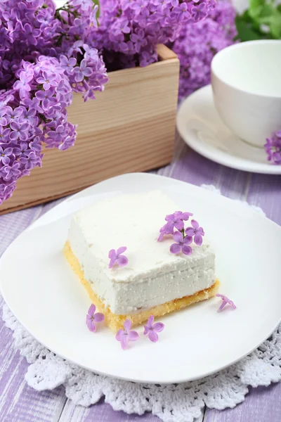 Dessert with lilac flowers