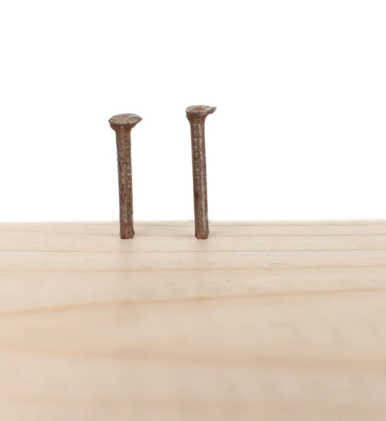 Nails in wooden board — Stock Photo, Image