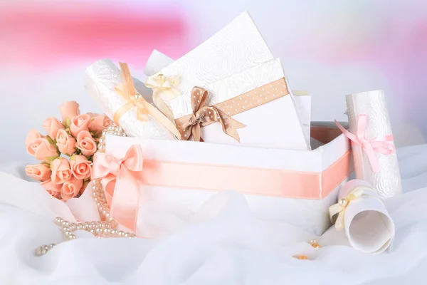 Beautiful handmade wedding cards in box, on light background — Stock Photo, Image