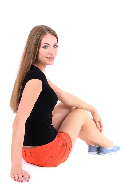 Mooi meisje in korte broek en t-shirt geïsoleerd op wit — Stockfoto