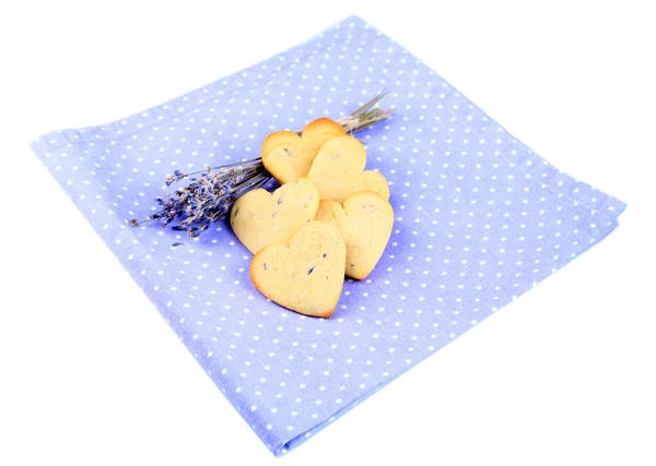 Lavender cookies on color napkin, isolated on white — Stock Photo, Image