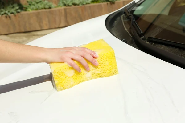Outdoor car wash with yellow sponge — Stock Photo, Image