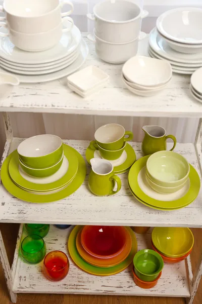 Different tableware on shelf in the interior — Stock Photo, Image