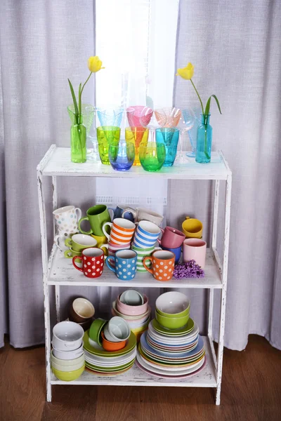 Different tableware on shelf in the interior — Stock Photo, Image