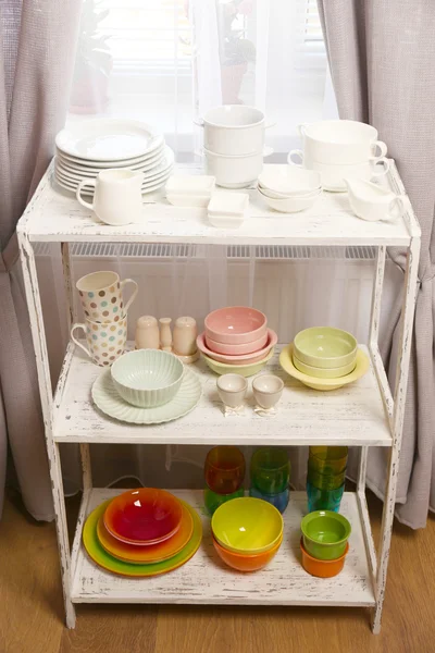 Different tableware on shelf in the interior — Stock Photo, Image