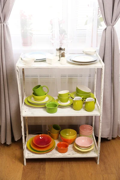 Different tableware on shelf in the interior — Stock Photo, Image