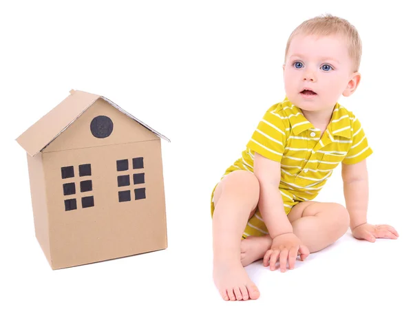 Cute little boy with cardboard house isolated on white — Stock Photo, Image