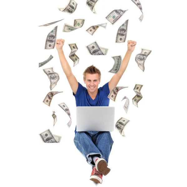 Knappe man met laptop en geld — Stockfoto