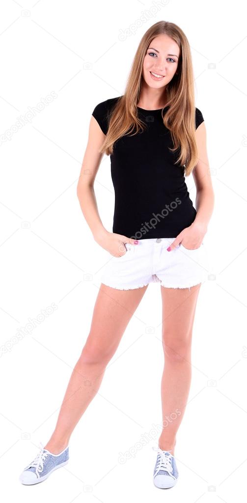 Beautiful young girl in shorts and t-shirt isolated on white — Stock ...