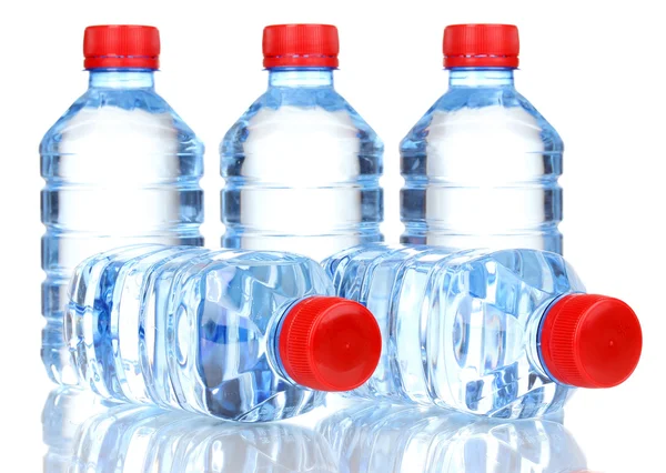 Plastic bottles of water isolated on white — Stockfoto