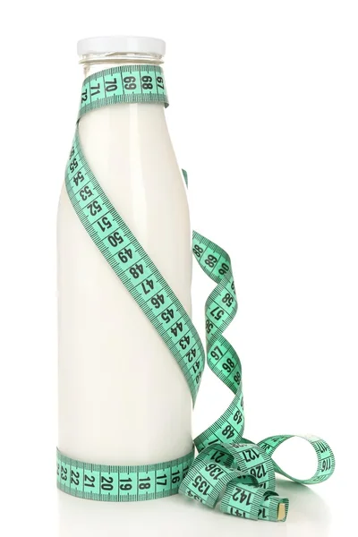 Bottle of milk with measuring tape isolated on white — Stock Photo, Image