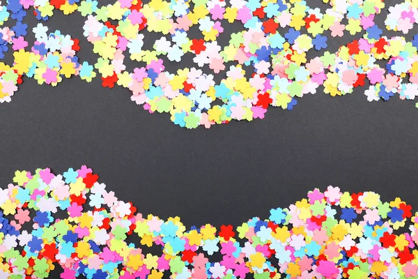 Confetti on black background — Stock Photo, Image