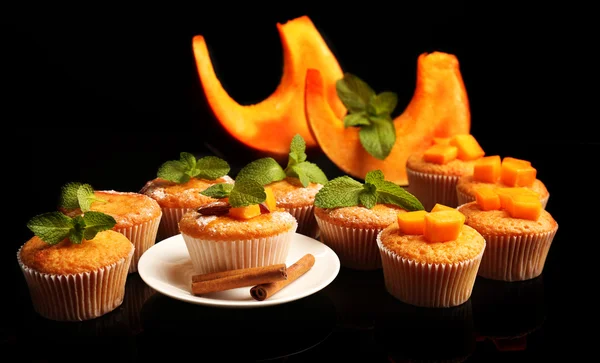 Tasty pumpkin muffins on dark background — Stock Photo, Image