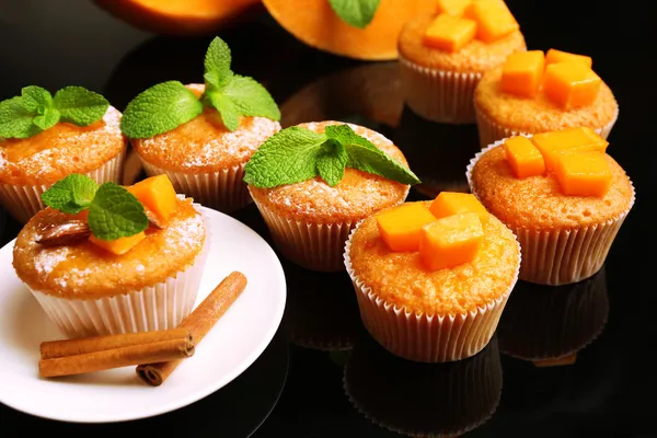 Tasty pumpkin muffins on dark background — Stock Photo, Image