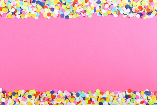 Confetti on pink background — Stock Photo, Image