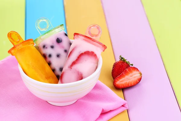 Fruit ice cream in bowl on wooden table close-up — Stock Photo, Image