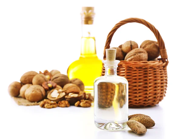 Walnut oil and nuts, isolated on white — Stock Photo, Image