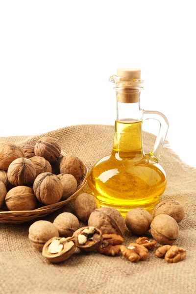 Walnut oil and nuts, isolated on white — Stock Photo, Image