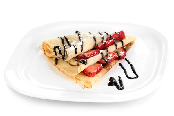 Delicious pancake with strawberries and chocolate on plate isolated white — Stock Photo, Image