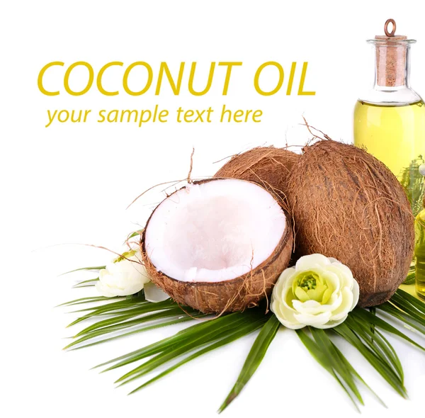 Coconuts and coconut oil, isolated on white — Stock Photo, Image