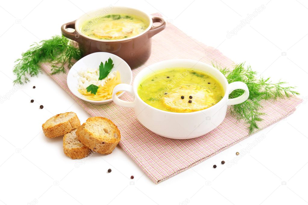 Tasty soup in saucepans, isolated on white