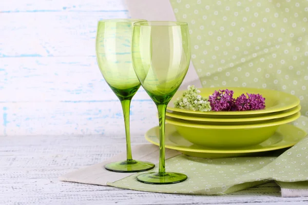 Green table settings, on table, on light background — Stock Photo, Image