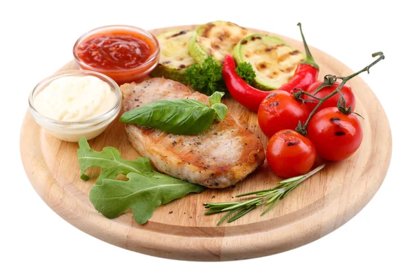 Grilled steak with spices, herbs and vegetables  on wooden board, isolated on white — Stock Photo, Image