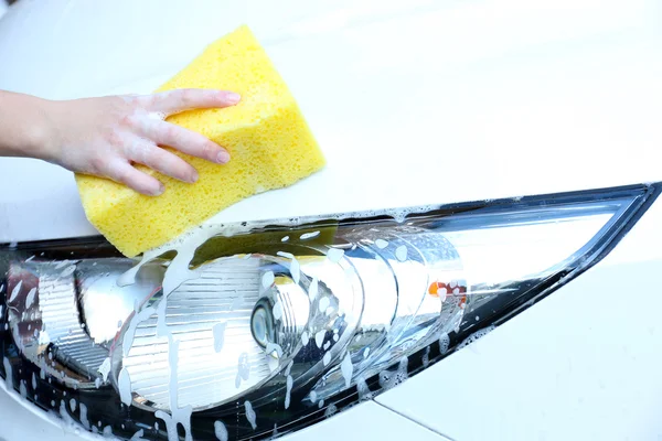 Outdoor car wash with yellow sponge — Stock Photo, Image