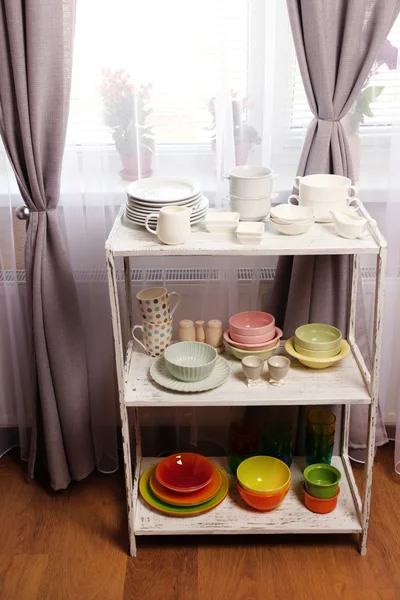 Different tableware on shelf in the interior — Stock Photo, Image