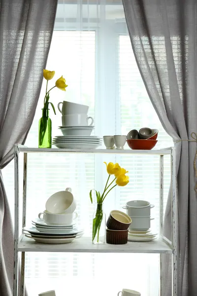 Different tableware on shelf in the interior — Stock Photo, Image