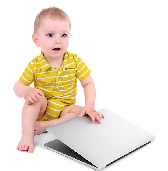 Menino bonito com laptop isolado em branco — Fotografia de Stock